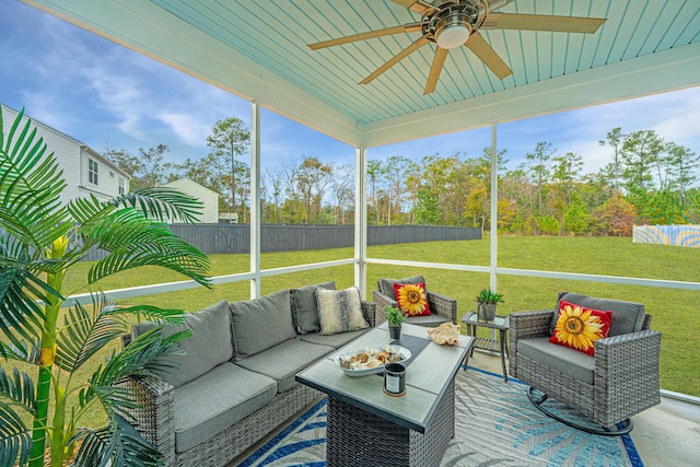 unfurnished sunroom featuring ceiling fan and wooden ceiling