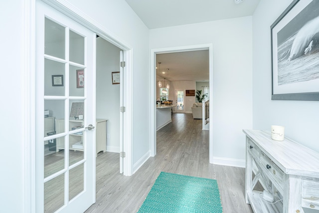 hall with light wood-type flooring