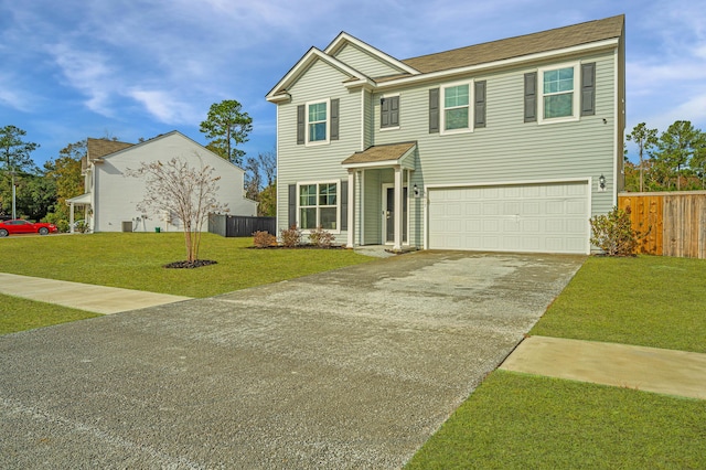 view of front of property featuring a garage and a front yard