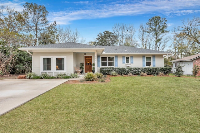 ranch-style home featuring a front yard