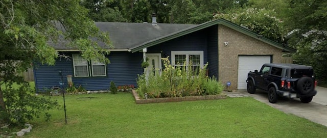 view of front of home with a front lawn and a garage