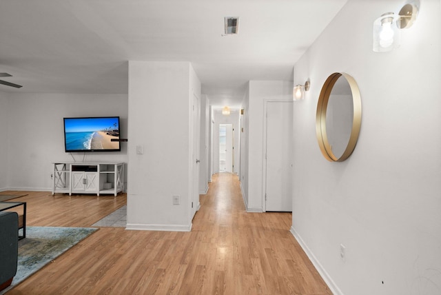 corridor featuring light hardwood / wood-style floors