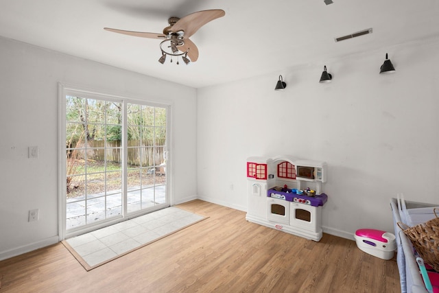 playroom featuring ceiling fan and wood-type flooring