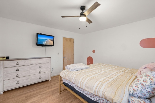 bedroom with ceiling fan and light hardwood / wood-style floors