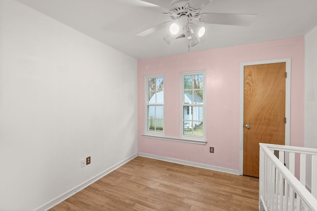 empty room featuring ceiling fan and light wood-type flooring