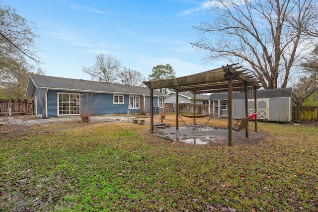 view of yard featuring a pergola, a patio, and a storage shed