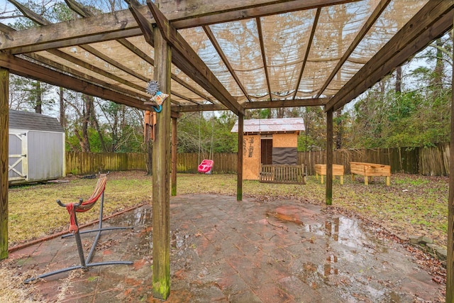 view of patio / terrace with a storage unit and a pergola