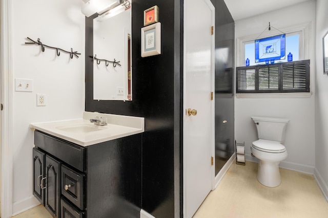 1485 Kinloch Ln, Mount Pleasant, SC 29464 - bathroom featuring toilet, baseboards, vanity, and a shower