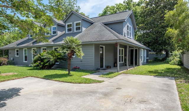 1485 Kinloch Ln, Mount Pleasant, SC 29464 - view of front facade with a front lawn, roof with shingles, and a patio area