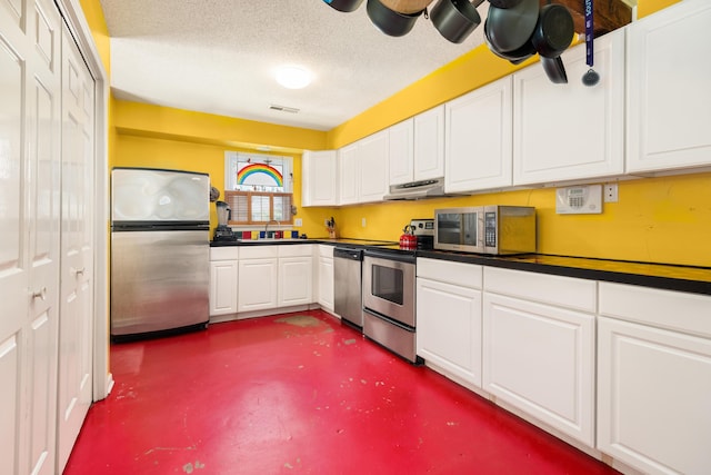 1485 Kinloch Ln, Mount Pleasant, SC 29464 - kitchen with appliances with stainless steel finishes, a sink, under cabinet range hood, dark countertops, and finished concrete flooring