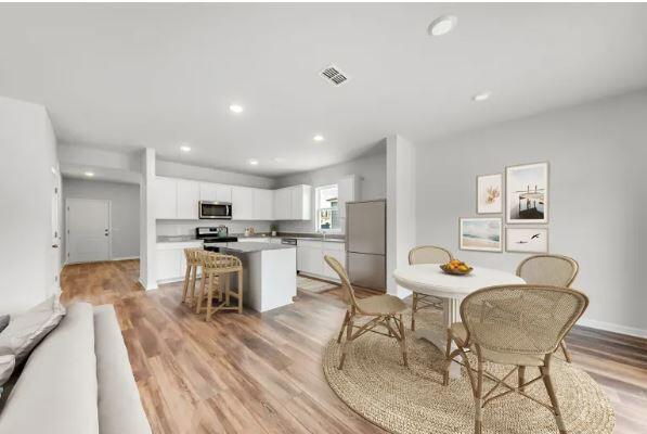 dining room with light hardwood / wood-style floors