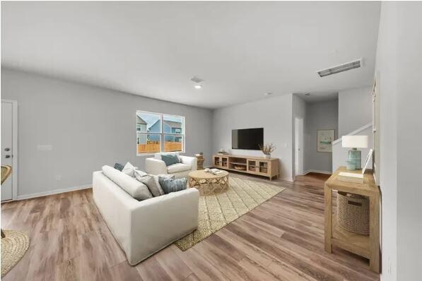 living room with hardwood / wood-style flooring