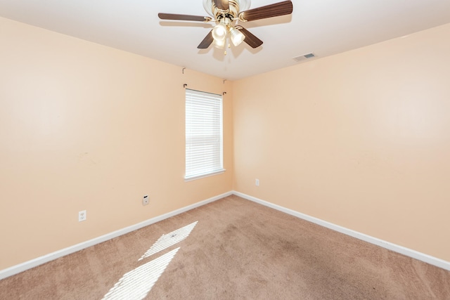 carpeted empty room with ceiling fan