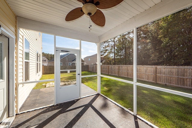 unfurnished sunroom featuring ceiling fan and wooden ceiling