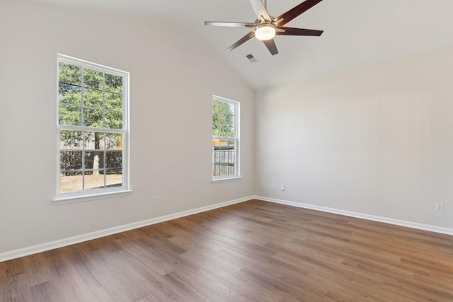 unfurnished room with hardwood / wood-style flooring, ceiling fan, and lofted ceiling