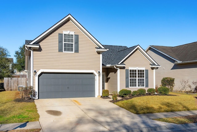 front of property with a garage and a front lawn