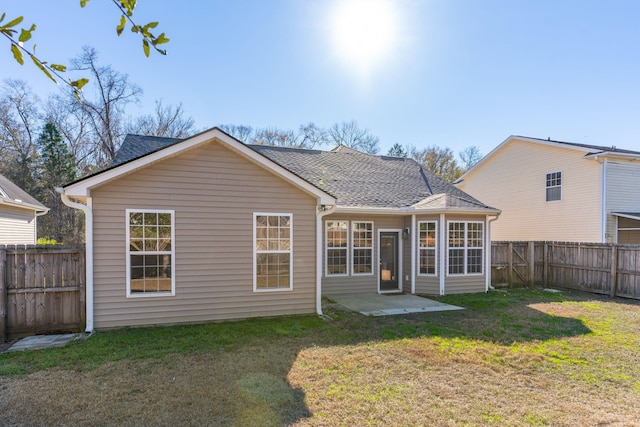 back of property featuring a patio area and a lawn