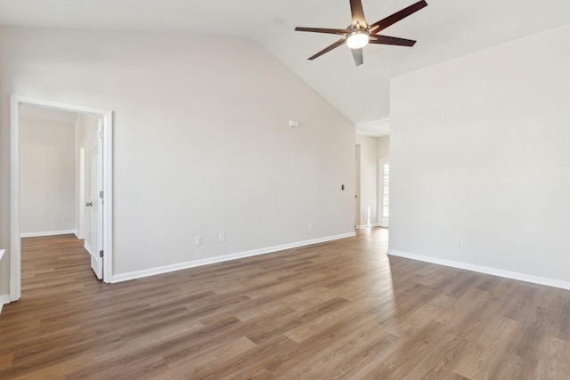 unfurnished room with hardwood / wood-style flooring, high vaulted ceiling, and ceiling fan