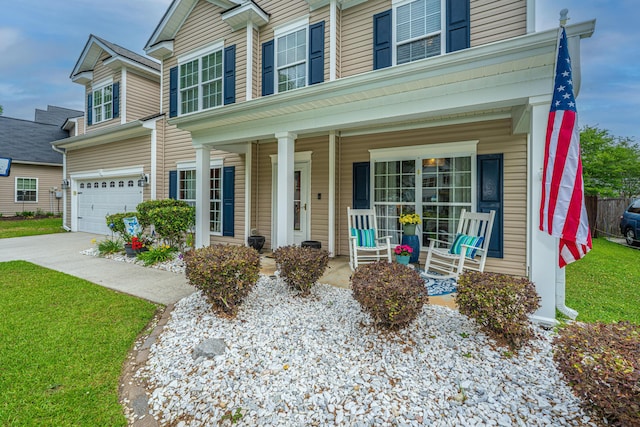 9636 Pebble Creek Blvd, Summerville, SC 29485 - view of front of home featuring a porch, driveway, a garage, and a front yard