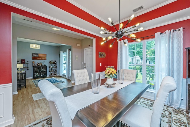 9636 Pebble Creek Blvd, Summerville, SC 29485 - dining room with wood finished floors, a chandelier, and crown molding