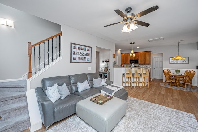 9636 Pebble Creek Blvd, Summerville, SC 29485 - living area featuring ceiling fan, stairway, and light wood-type flooring