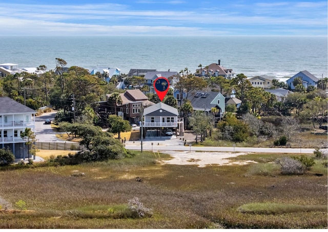 bird's eye view with a residential view and a water view