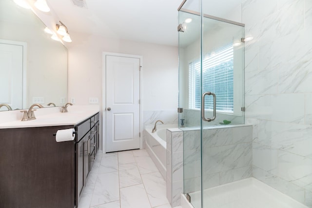 bathroom with vanity and independent shower and bath