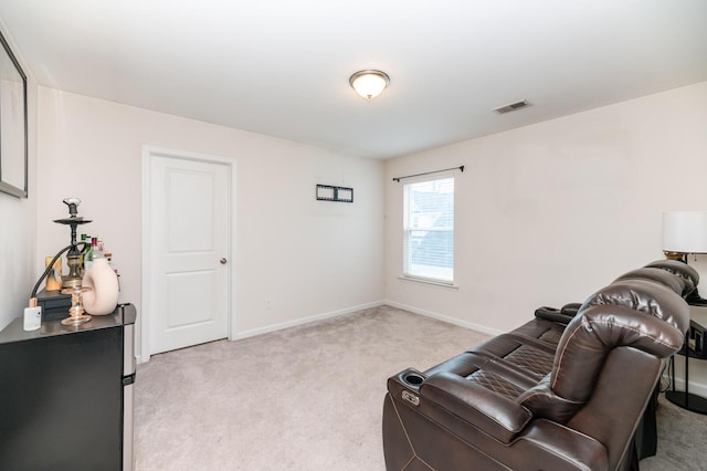 living area with light colored carpet