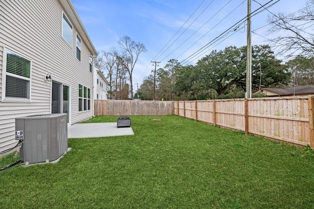 view of yard with cooling unit and a patio area