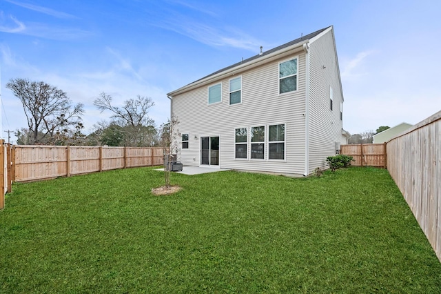 back of property with a patio and a lawn