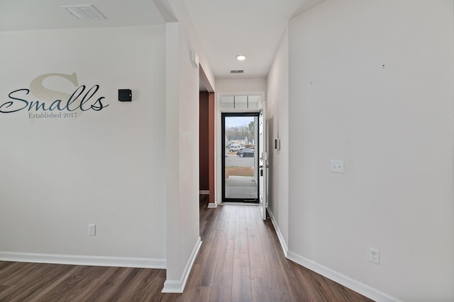 corridor featuring dark wood-type flooring