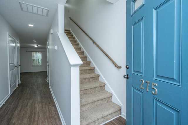 foyer entrance with dark hardwood / wood-style flooring