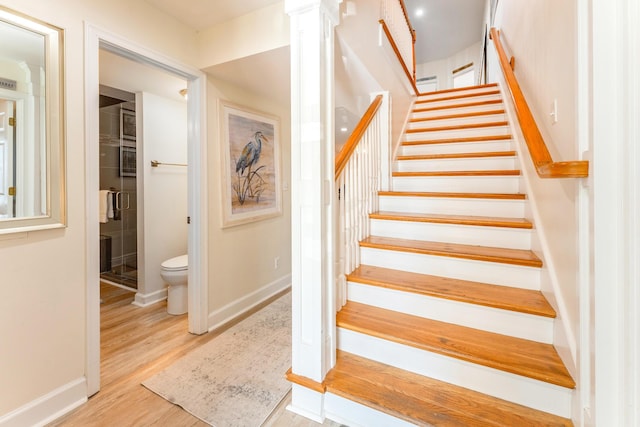 staircase featuring wood-type flooring