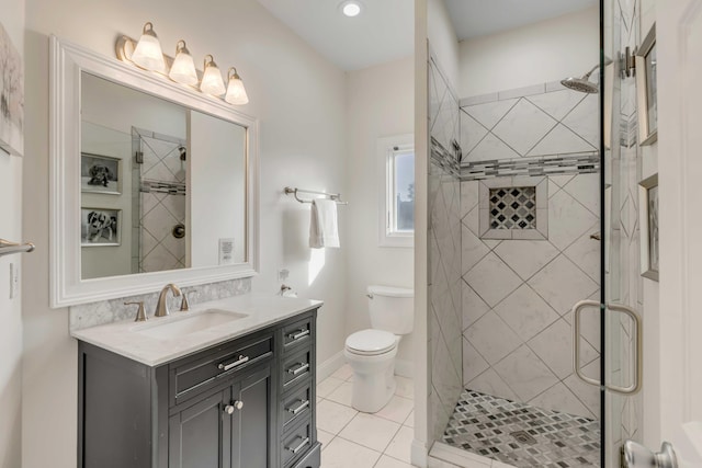 bathroom featuring a shower with door, toilet, tile patterned flooring, and vanity