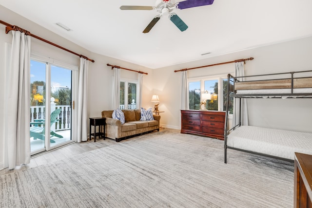 bedroom with ceiling fan, access to exterior, and light hardwood / wood-style floors