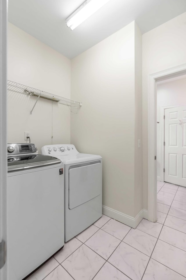 clothes washing area featuring washing machine and clothes dryer