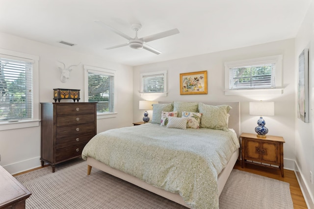 bedroom featuring ceiling fan and light hardwood / wood-style floors