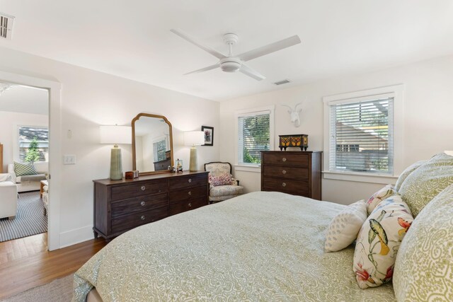 bedroom featuring hardwood / wood-style flooring and ceiling fan