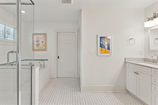 bathroom featuring vanity, tile patterned floors, and plus walk in shower