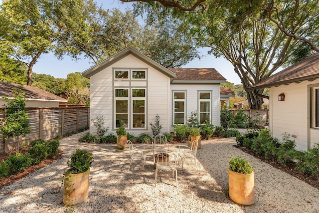 back of property with a patio