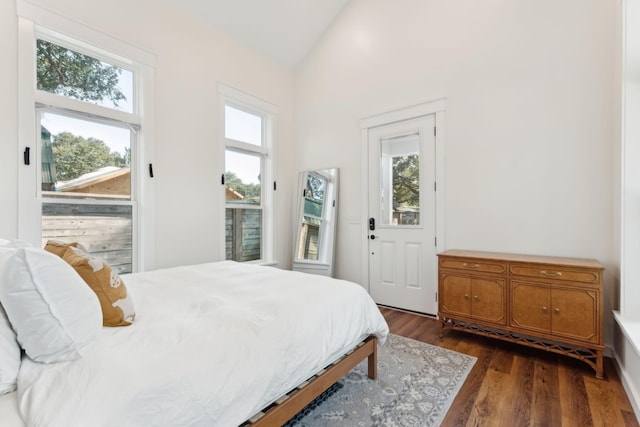 bedroom featuring dark hardwood / wood-style floors and vaulted ceiling