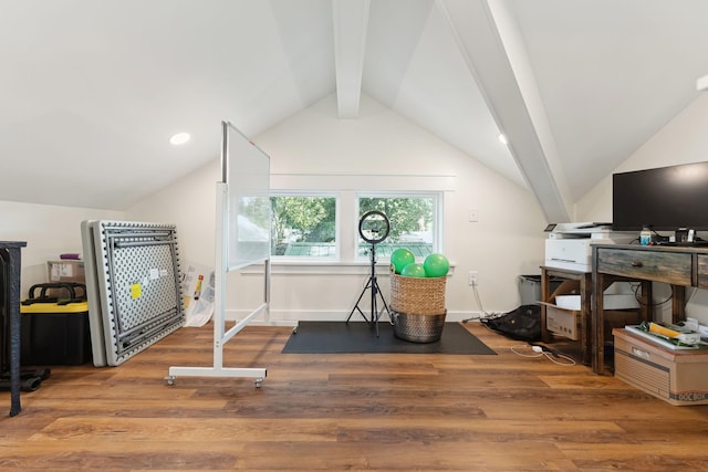 exercise room featuring lofted ceiling and wood-type flooring