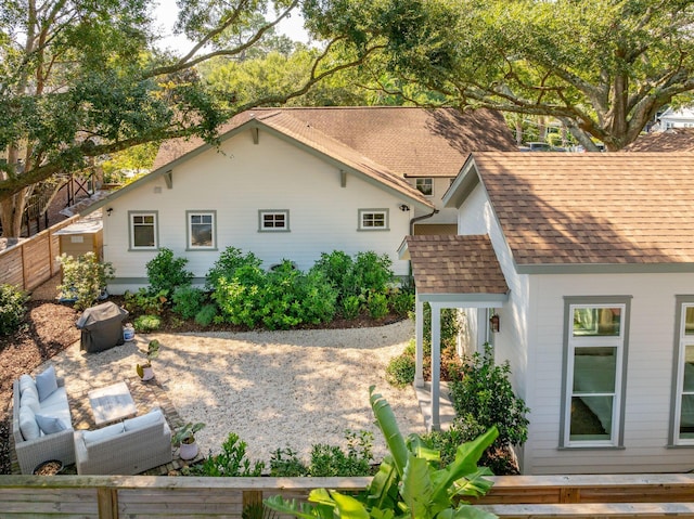 back of house featuring an outdoor hangout area