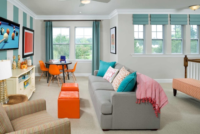 carpeted living room with crown molding, a wealth of natural light, and ceiling fan