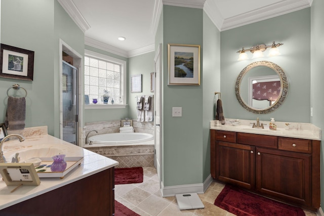 bathroom with a shower stall, crown molding, a garden tub, two vanities, and a sink