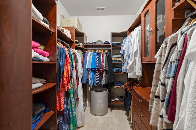 walk in closet with carpet and visible vents