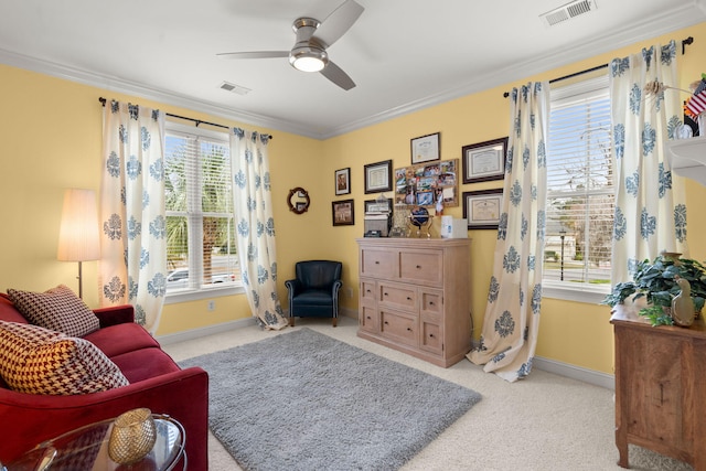 sitting room featuring visible vents, baseboards, carpet, and ornamental molding