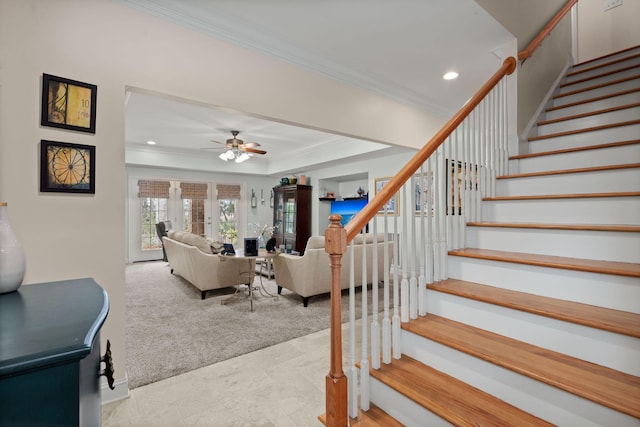 interior space featuring a tray ceiling, recessed lighting, carpet, crown molding, and ceiling fan