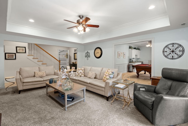 living room featuring pool table, crown molding, stairway, a raised ceiling, and a ceiling fan