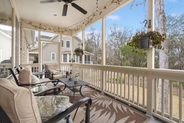 sunroom with a ceiling fan